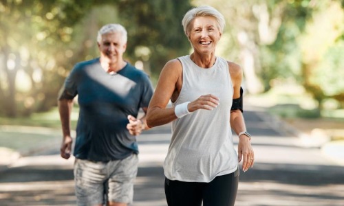 a man and woman running