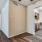 a large room with good lighting leading to other rooms