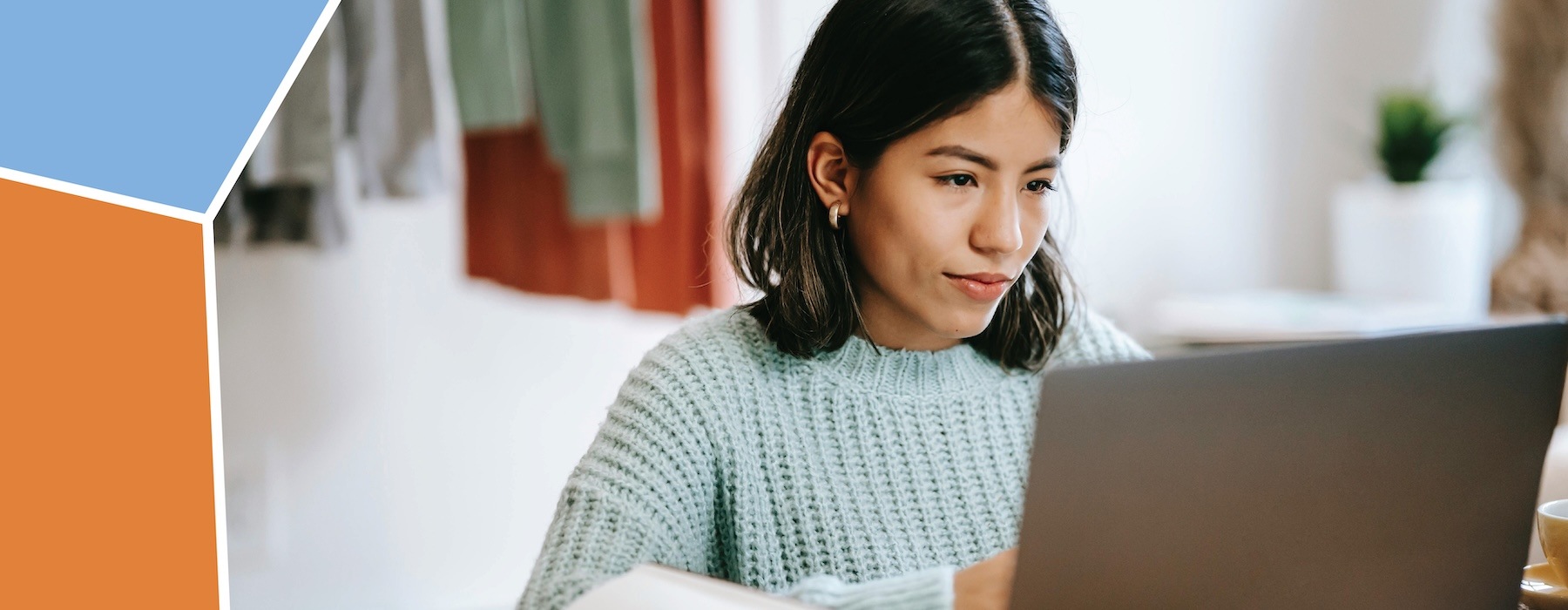 a woman looking at a laptop