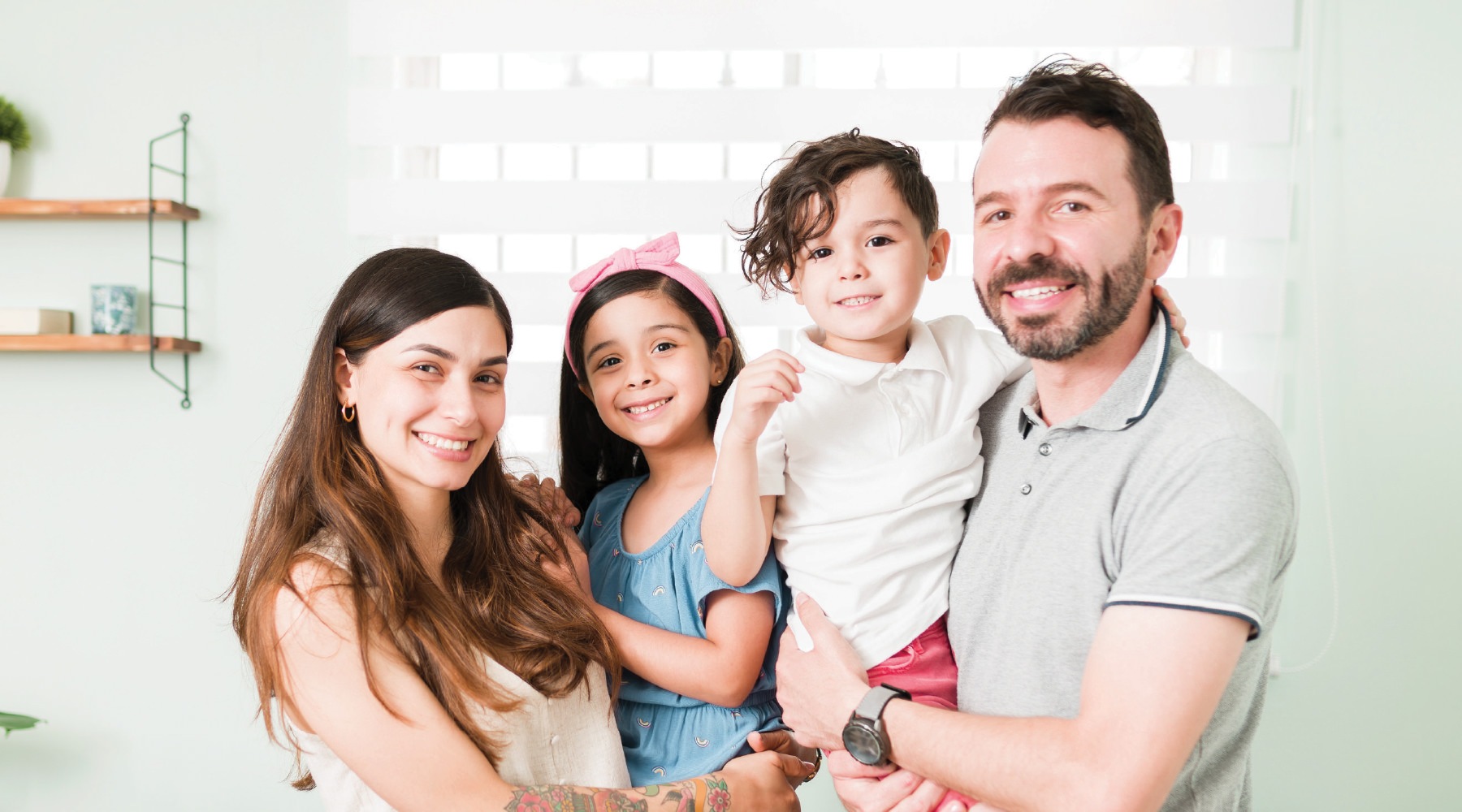 a family posing for a picture in a kitchen