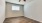 a bedroom with a ceiling fan and a window
