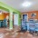 a leasing area with a kitchen and many colorful walls